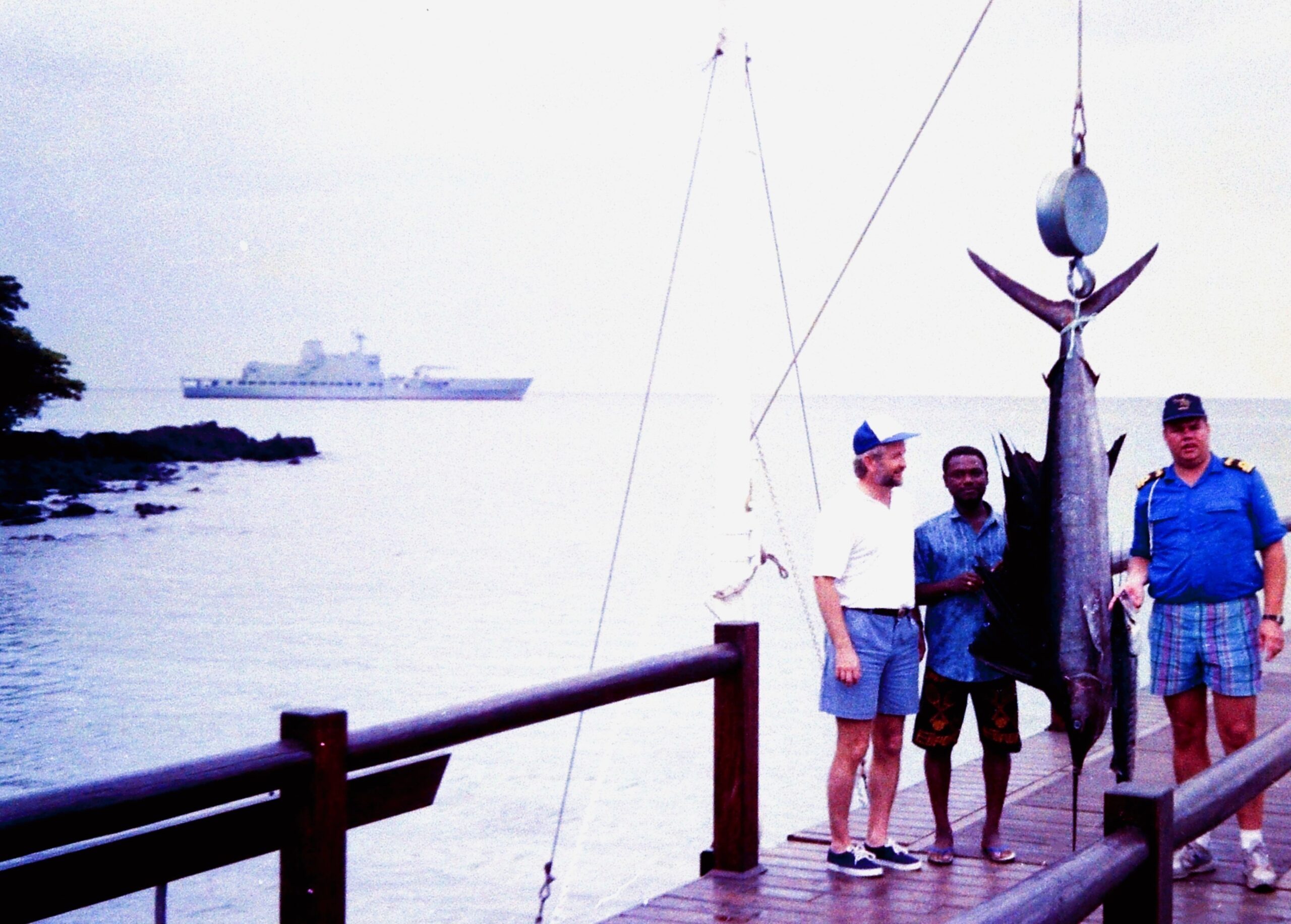 Nongqai Blog A week-end R&R stop was included in the 1994 Friendship Cruise in the Gulf of Guinea, enjoying the amenities of the then South African managed Bom-Bom Island Resort on Principe in the DRSTP. It included an angling contest between the “vloties” and the diplomats – which the latter won, thanks to this sailfish landed by Amb. Steenkamp. At the weigh-in, the SAS Drakensberg is visible in the background.