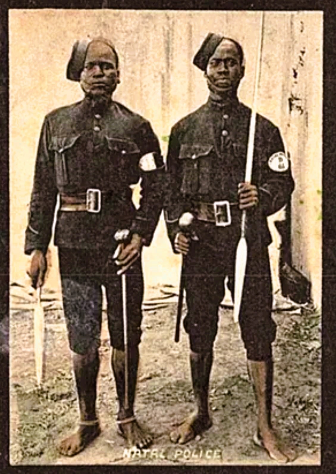 Nongqai Blog Two African Members of the Natal Police circa 1905 - barefooted and armed with assegai's and knopkieries. Their armlets serve as their appointment certificates.